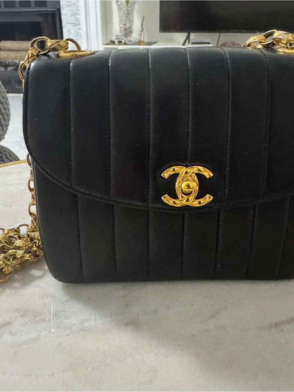 CHANEL Black Vertical Quilted Lambskin Shoulder Bag with Gold Hardware